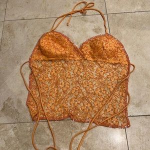 Wet seal sparkly open back halter top. Peach color size medium. Cups lined